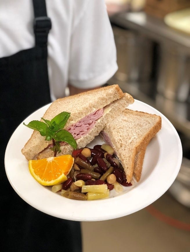 Lynn valley care centre, chef displays meal in bowl