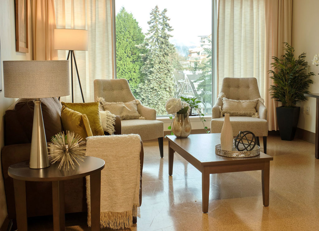 window view of trees and mountains at lynn valley care centre