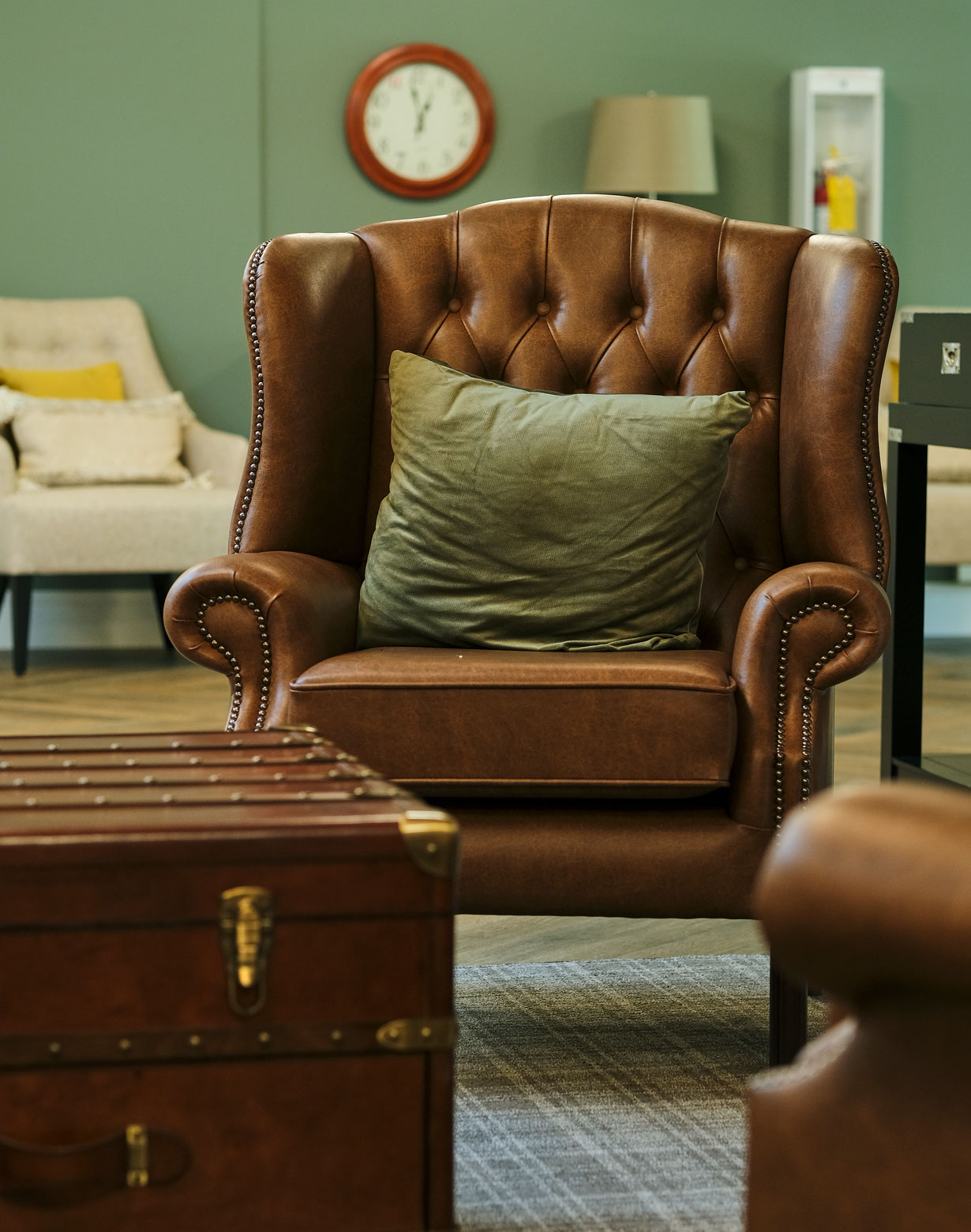 living room with leather chairs
