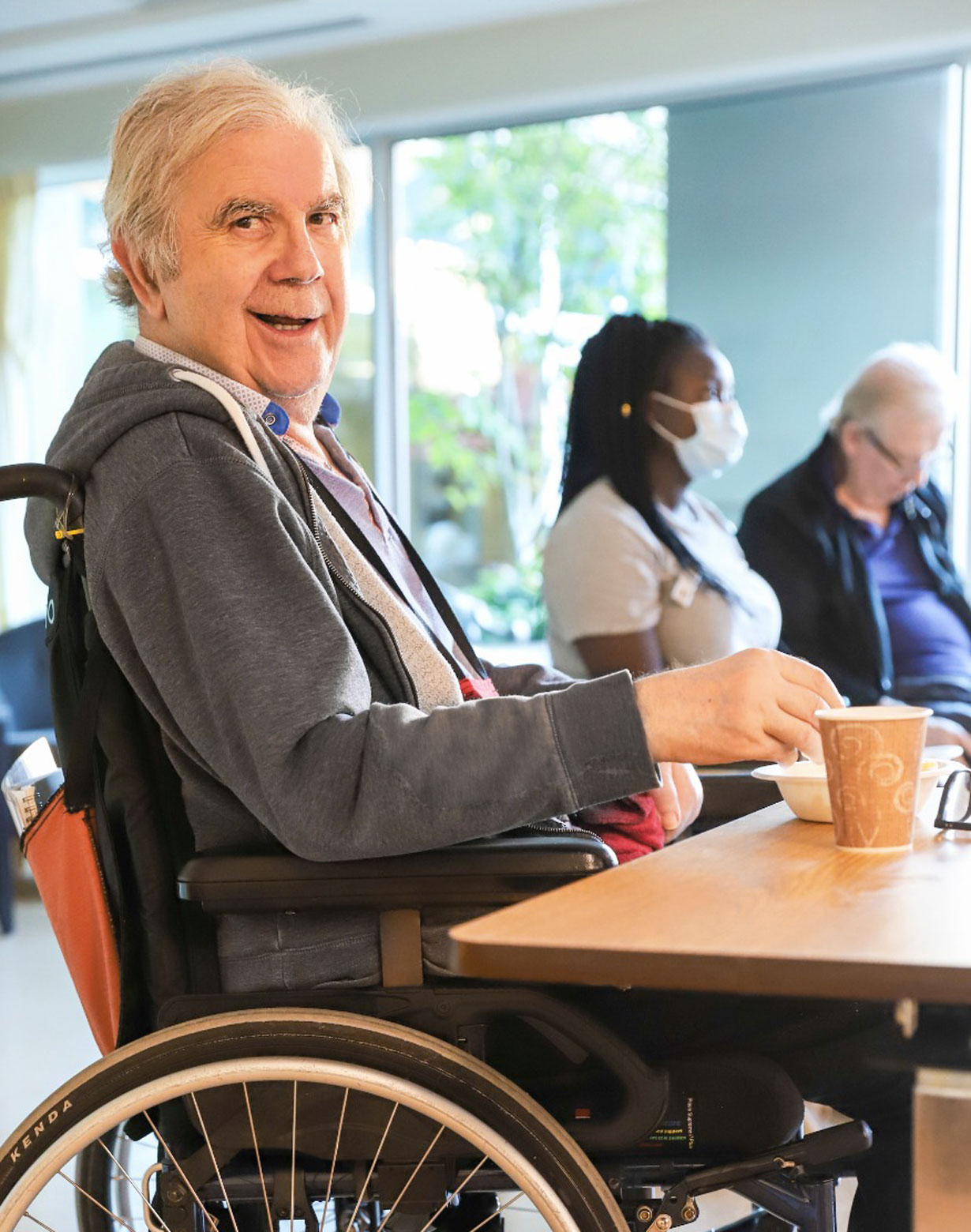 lynn valley care centre, care home, senior in wheelchair smiling