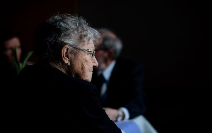 Elderly woman looking disappointed at senior healthcare