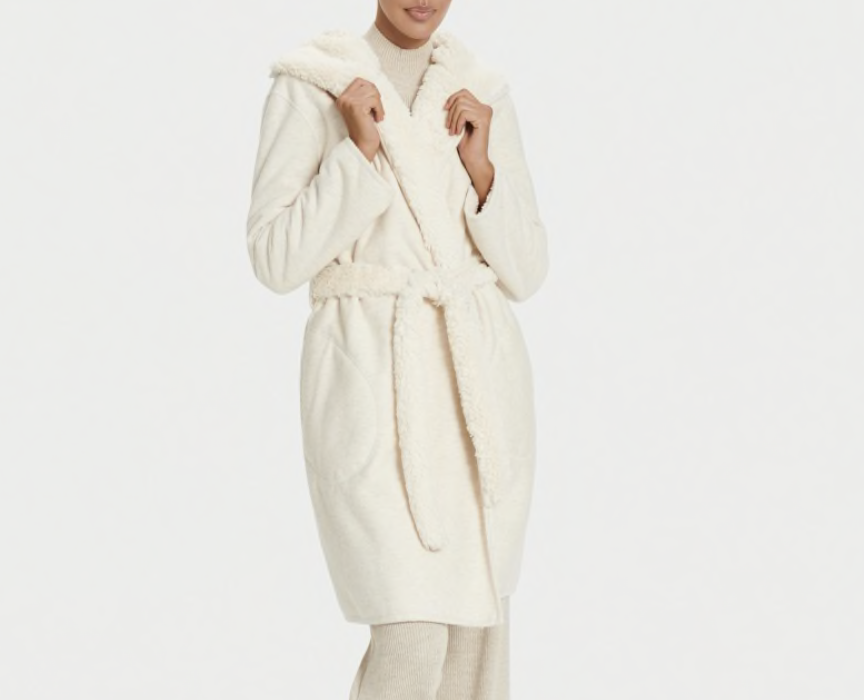 woman wearing cream colorer robe