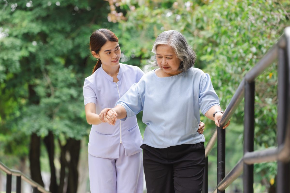 nurse taking care of elderly patient