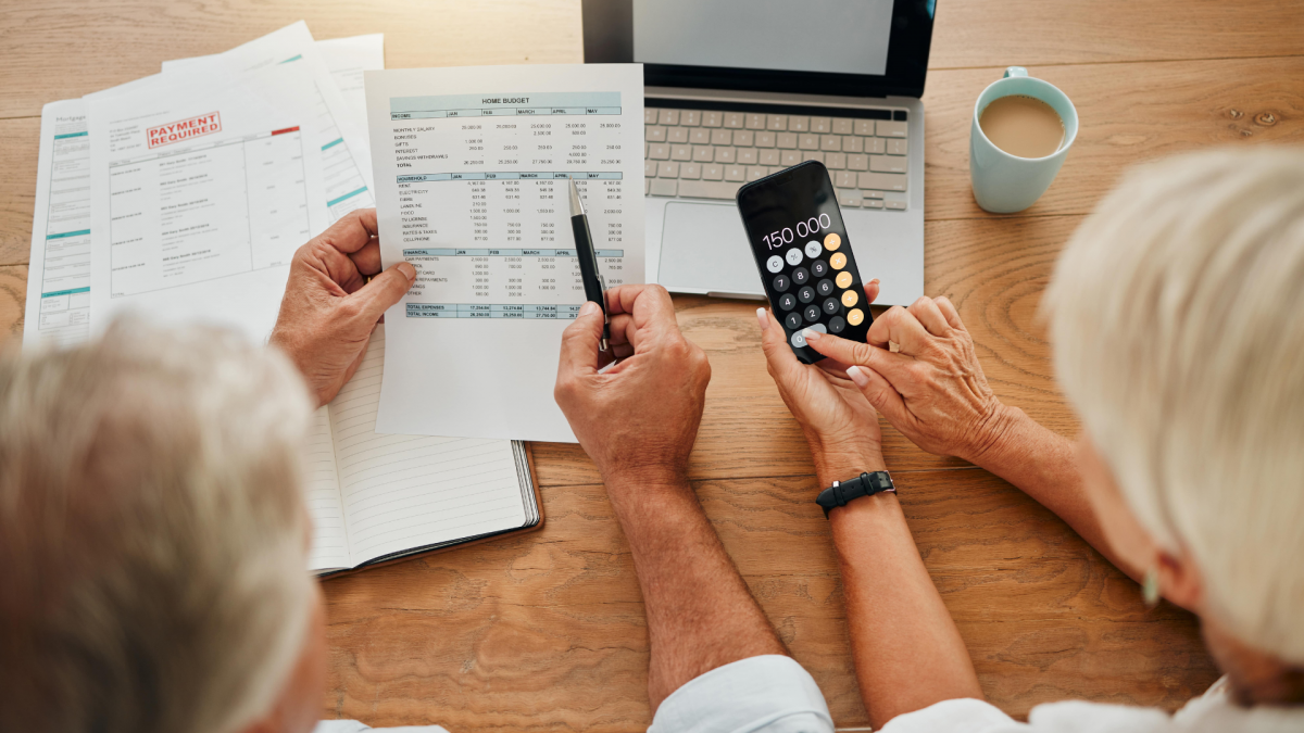 Elderly people at table exploring senior benefits in canada