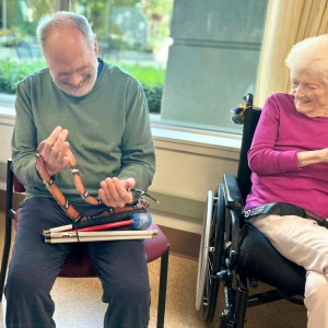 Senior residents interact with snake at Lynn Valley Care Centre