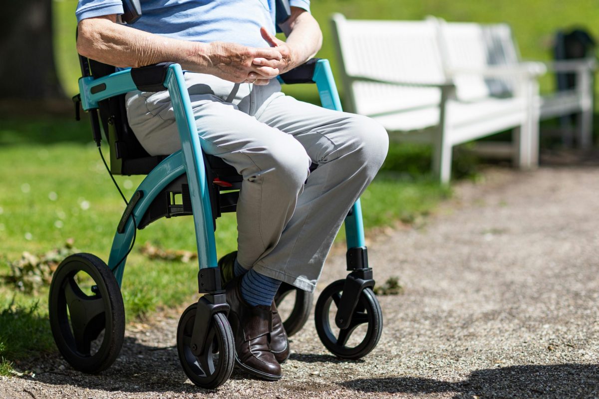 older senior chair yoga man sitting in walker park
